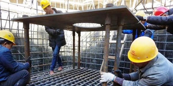 Seismic isolator pre-embedded plate installation
