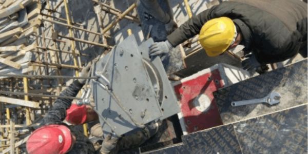 Install the upper pre-embedded plate of seismic isolator. 