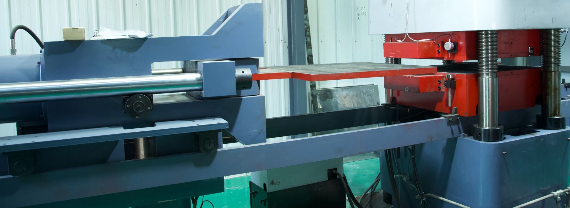 The machine is testing the finished seismic isolator.